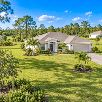 More Home and Land for the Money in Lehigh Acres Spacious single-family home with a large yard in Lehigh Acres, representing larger lots and more space for buyers